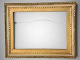 a picture of a gold framed mirror on the wall