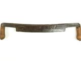 a picture of an old wooden handle with a wooden handle