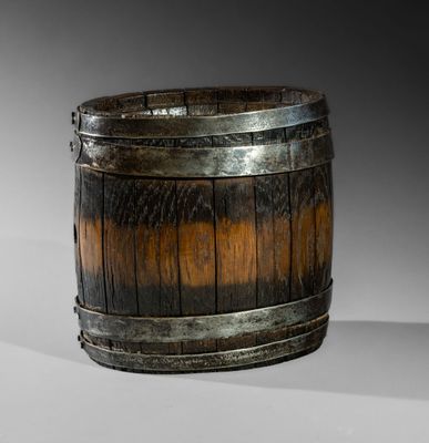 a wooden barrel that is sitting on a table