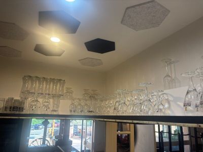 many wine glasses on the shelf in the room