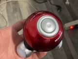 a person holding a remote control in their hand