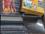 a lot of dvds in a box on the floor