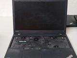 a laptop that is sitting on a table with a keyboard