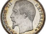 a close up of a coin with a man ' s face on it