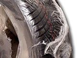 a tire that has been wrapped in plastic to protect it from the sun