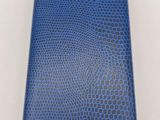a blue and black lizard skin wallet with a gold clasp