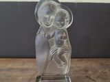 an image of a glass figurine of a woman holding a baby