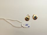a close up of a tag with a pair of earrings on it