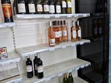 many bottles of wine on the shelves in the store