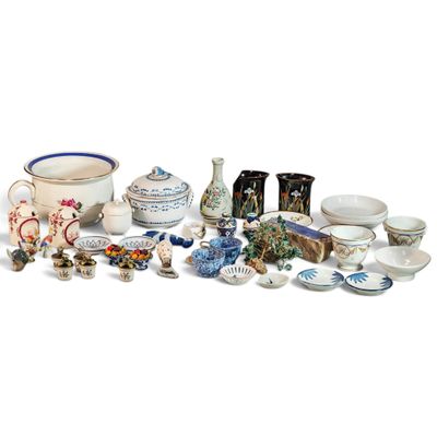 many different types of pottery on display on the table
