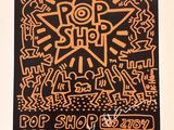 an orange and black poster with a design on it