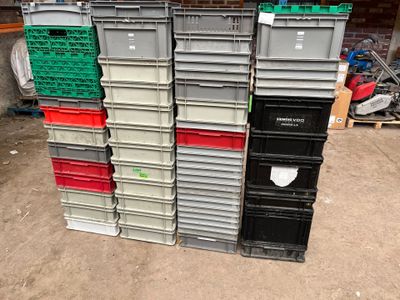 many plastic containers stacked on top of each other