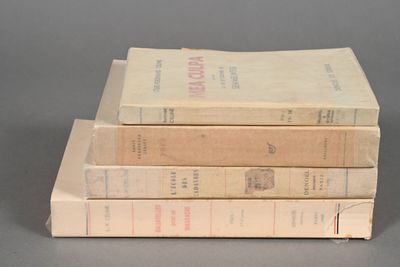 three books stacked on top of each other on a table