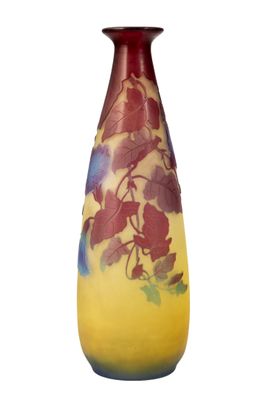 a yellow vase with a red and blue design on it
