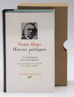 the book is sitting in front of a box with a picture of a man ' s face on it