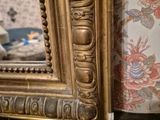a mirror that is sitting on a table in a room