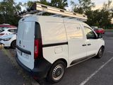 a white van that is parked in a parking lot