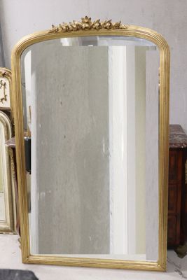 a mirror that is sitting on a table next to other mirrors