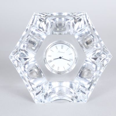 a crystal clock sitting on top of a table