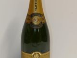 a close up of a bottle of champagne on a table