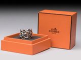 an orange box with a silver ring inside of it