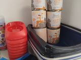 many containers of food on a shelf next to a red cup