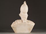marble bust of a man with a hat on top of it