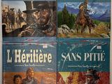 Quatre livres en espagnol sont posés sur une table devant un mur blanc.