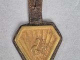 une image représentant une médaille d'or sur laquelle figure le portrait d'une femme