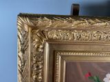 a picture of a painting of flowers in a gold frame