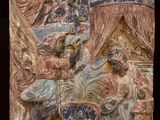 une image représentant un relief en pierre représentant un homme et une femme dans une pièce