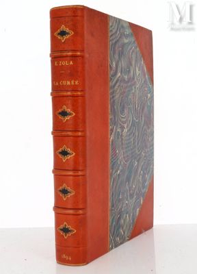 an old book sitting on top of a white table next to a white wall