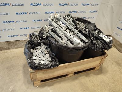 a pile of metal parts in a wooden crate