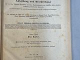 un vieux livre avec du texte en allemand posé sur une table