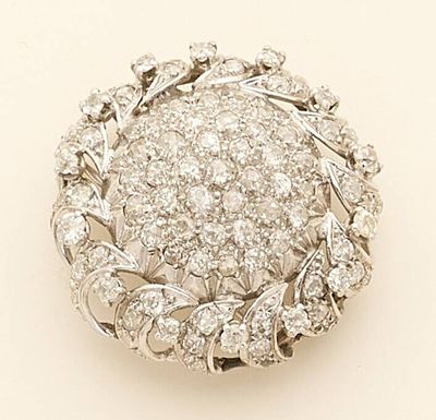 a close up of a diamond broochle on a white background