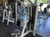 a gym room with a lot of machines in it