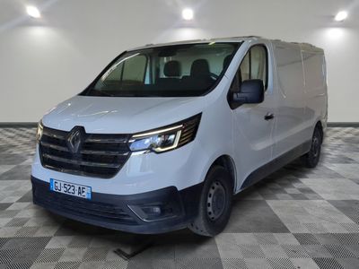 the white van is parked on a checkered floor in a room