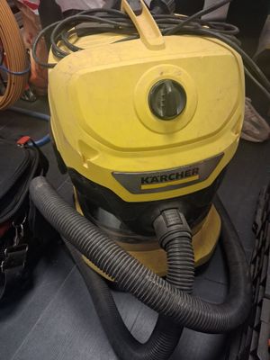 a yellow vacuum cleaner sitting on top of a table