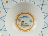 a plate with a picture of a lighthouse on it