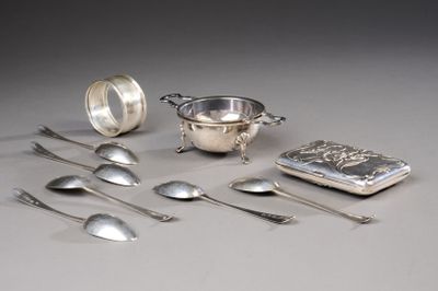 a lot of silver spoons and spoons on the table