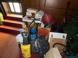 a room with a lot of clutter and boxes on the floor