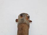 a wooden stick that has a piece of wood sticking out of it