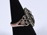 a close up of a ring on a black ring stand