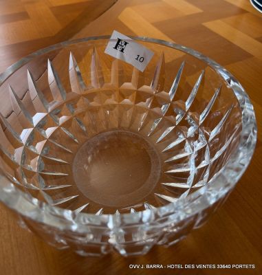 a glass bowl on a table with a price tag on it