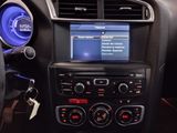 the dashboard of a car with a radio and speakers in it