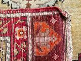 an image of a close up of a rug with a cat on it