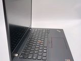 a laptop with a black keyboard on a white surface