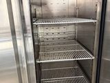 a stainless steel refrigerator that is open to show the inside
