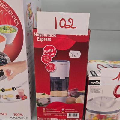 two boxes of food and a blender sitting on a counter