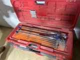 a red tool box with tools in it on the floor